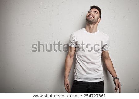 [[stock_photo]]: Young Man In Tshirt And Jeans Smiling