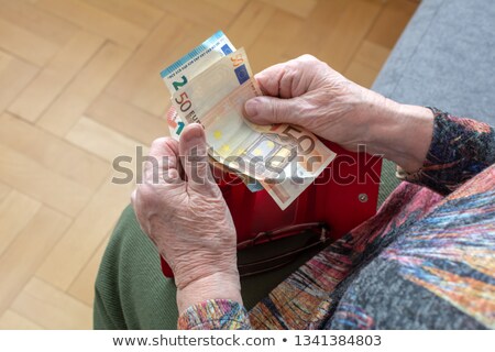 Stock foto: Senior Woman Holding Hundred Euro Money Banknotes