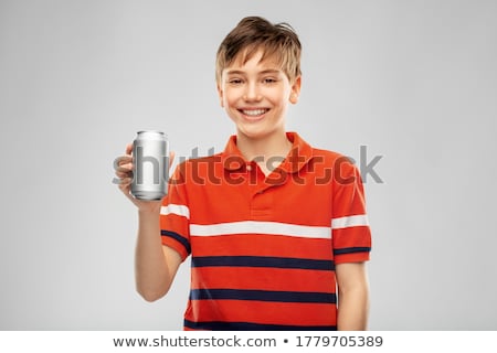 Foto stock: Boy In Red T Shirt Drinking Soda From Tin Can