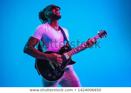 Stock photo: The Guitarist On Blue