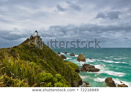 Nugget Point Light House And Dark Clouds In The Sky Stock photo © 3523studio