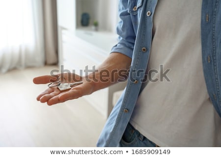 商業照片: Cropped Up Of Man Offering Key