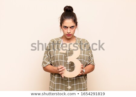 Сток-фото: Portrait Of Girl Holding Number 3