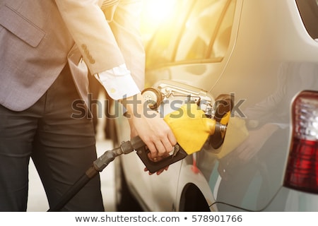 Stockfoto: Man Filling Up Fuel Into Car