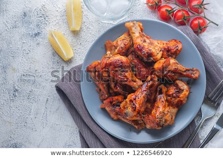 Stockfoto: Chicken Pieces With Hot Sauce