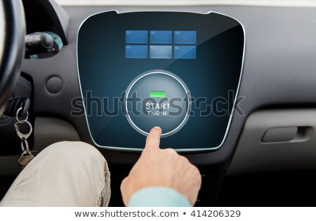 Stock photo: Close Up Of Man Using Starter Application In Car