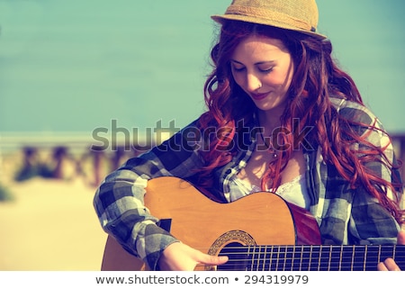 Сток-фото: Beautiful Redhead Woman Playing Acoustic Guitar