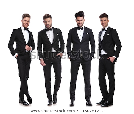 Stock foto: Relaxed Elegant Man In Tuxedo Standing With Legs Crossed