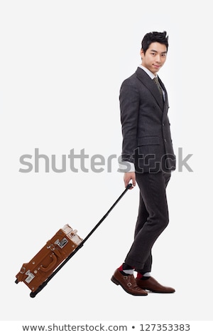 Stock foto: Businessman Departs To A Business Trip With Symbols