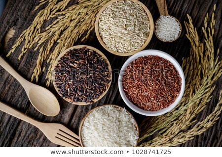 ストックフォト: Black Bowl Of Raw Organic Red Rice On White Background Healthy Food