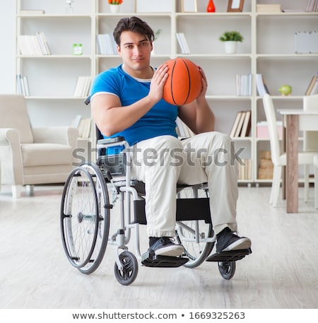 Stockfoto: Young Basketball Player On Wheelchair Recovering From Injury