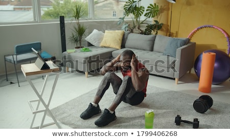 Stock photo: Muscular Man Exercising Biceps With Dumbbells