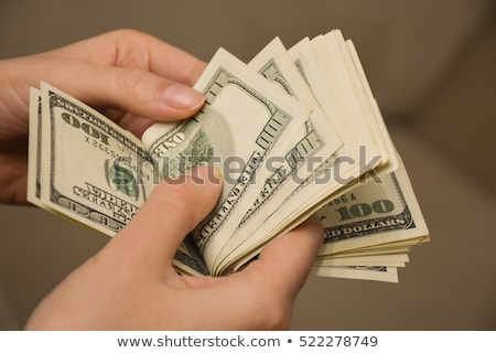 Foto stock: Girl Counts The Money On An Isolated