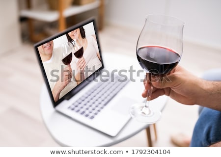 Stock fotó: Laptop And Glass Of Wine On A