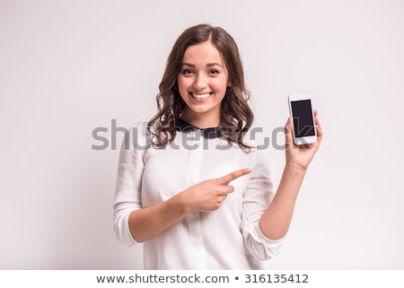 ストックフォト: Pretty Happy Woman Holding A Mobile Phone