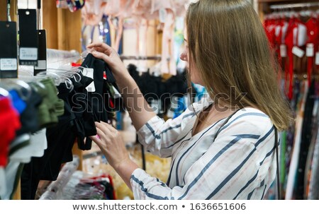 Foto stock: A Pretty Woman Buying Bras