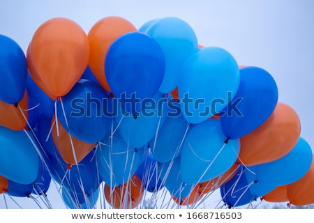 Stock photo: Close Up Of White Helium Balloons In Blue Sky