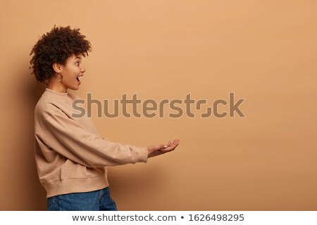 Zdjęcia stock: Teenage Girl Pretending To Be Hold Invisible Object