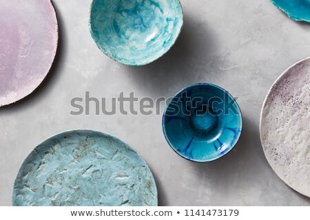 Zdjęcia stock: Multi Colored Glay Vintage Handmade Dishes Flat Lay Set Of Porcelain Blue Bowls On A Gray Concrete