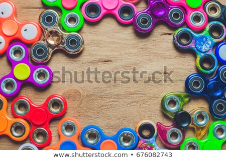 Stock fotó: Fidget Spinners On Wooden Background With Copy Space Popular Relaxing Toy Generic Design