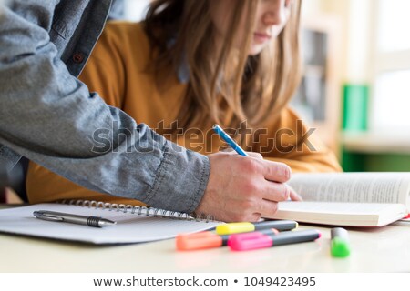 Stok fotoğraf: Confident Adult Teacher Helping To Students In School Classroom