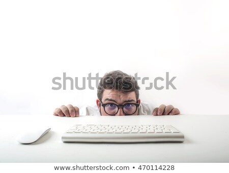 Сток-фото: Portrait Of A Young Man With A Computer Hiding His Face