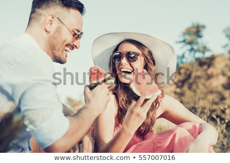 Stock photo: Loving Couple In Nature Eat Watermelon