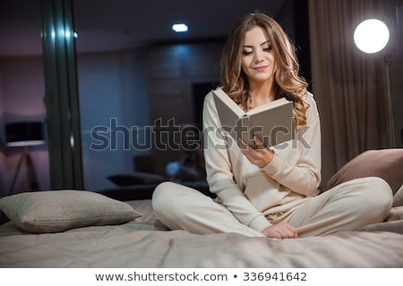 Foto stock: Happy And Smiling Woman In Cotton Pajamas