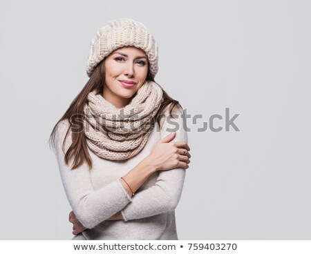 Stok fotoğraf: Young Woman Wearing Warm Winter Clothes And Hat In Studio