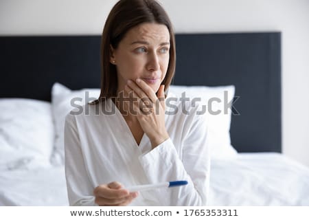 Stock fotó: Woman Looking At Result Of Home Pregnancy Test Kit