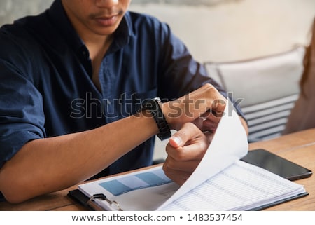 Stok fotoğraf: Business Executive Checking The Time