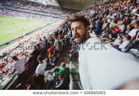 [[stock_photo]]: Excited Handsome Football Fan Cheering