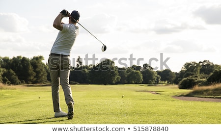 Foto stock: Ogador · de · golfe · acertando · a · bola