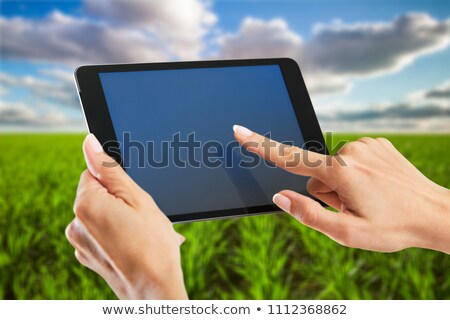 Stock foto: Female Farmer Using Tablet Computer In Barley Crop Field