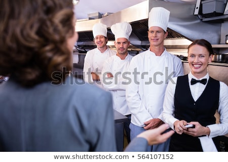 Zdjęcia stock: Restaurant Manager Briefing To His Kitchen Staff