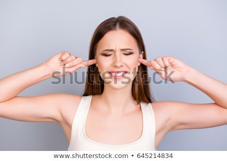 Stok fotoğraf: Unhappy Woman Closing Ears By Fingers