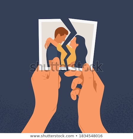 Foto stock: Couple Holding Torn Photograph