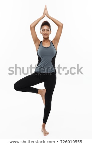 Foto stock: Young Woman Doing Exercises On White