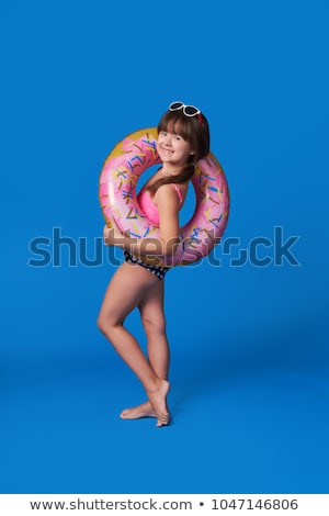 Stok fotoğraf: Summertime Women Bikini Swimsuit Inflatable Ring