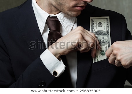 Stok fotoğraf: Dollars In Pocket Of Coat