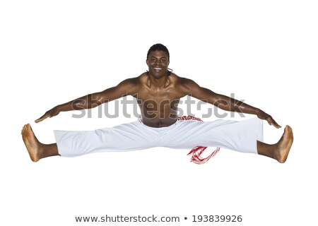 Stockfoto: Capoeira Brazilian Man Jumping Dressed In White Pants