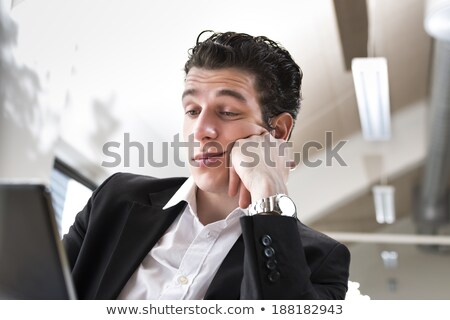 ストックフォト: Bored Businessman In Front Of His Laptop