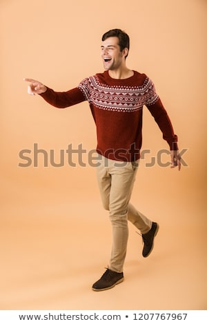 Сток-фото: Full Length Image Of Cheerful Man 20s With Bristle Wearing Knitt