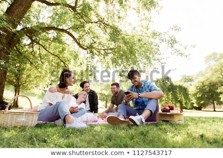 Stock photo: Friends With Smartphones On Picnic Blanket