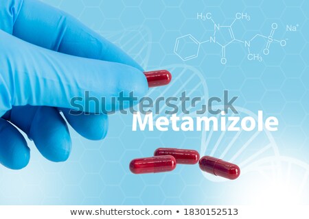 Foto stock: Handing Over Colorful Painkillers