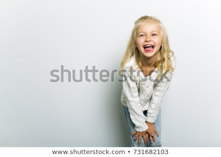 Foto stock: A Cute Girl 5 Year Old Posing In Studio