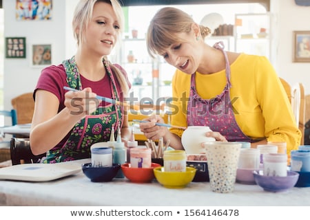 Stockfoto: Two Girl Friends Painting Their Own Handmade Ceramics