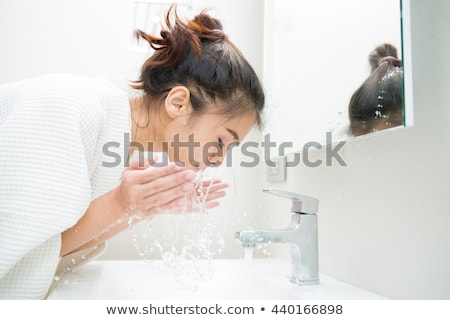 Сток-фото: Young Girl Washes With Clean Water