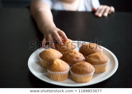 Сток-фото: Naughty Kid Taking A Cake From The Table