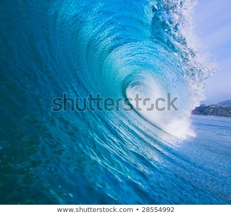 Stok fotoğraf: Large Blue Surfing Wave Breaks In The Ocean